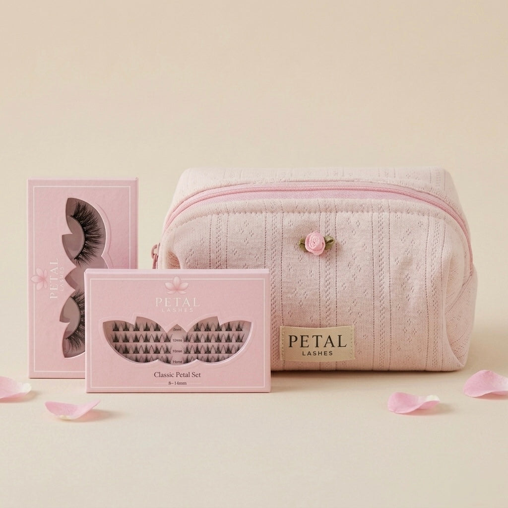 Pink makeup bag with 'Petal' branded eyelash packaging on a beige background