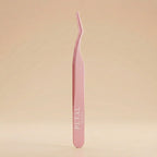 Pink tweezers with 'Petal' branding on a beige background