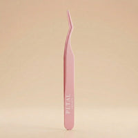 Pink tweezers with 'Petal' branding on a beige background