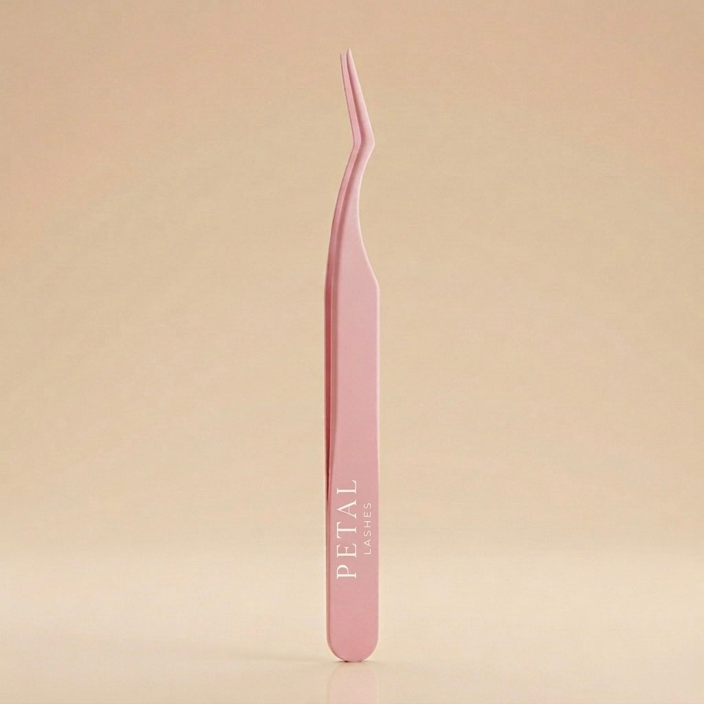 Pink tweezers with 'Petal' branding on a beige background