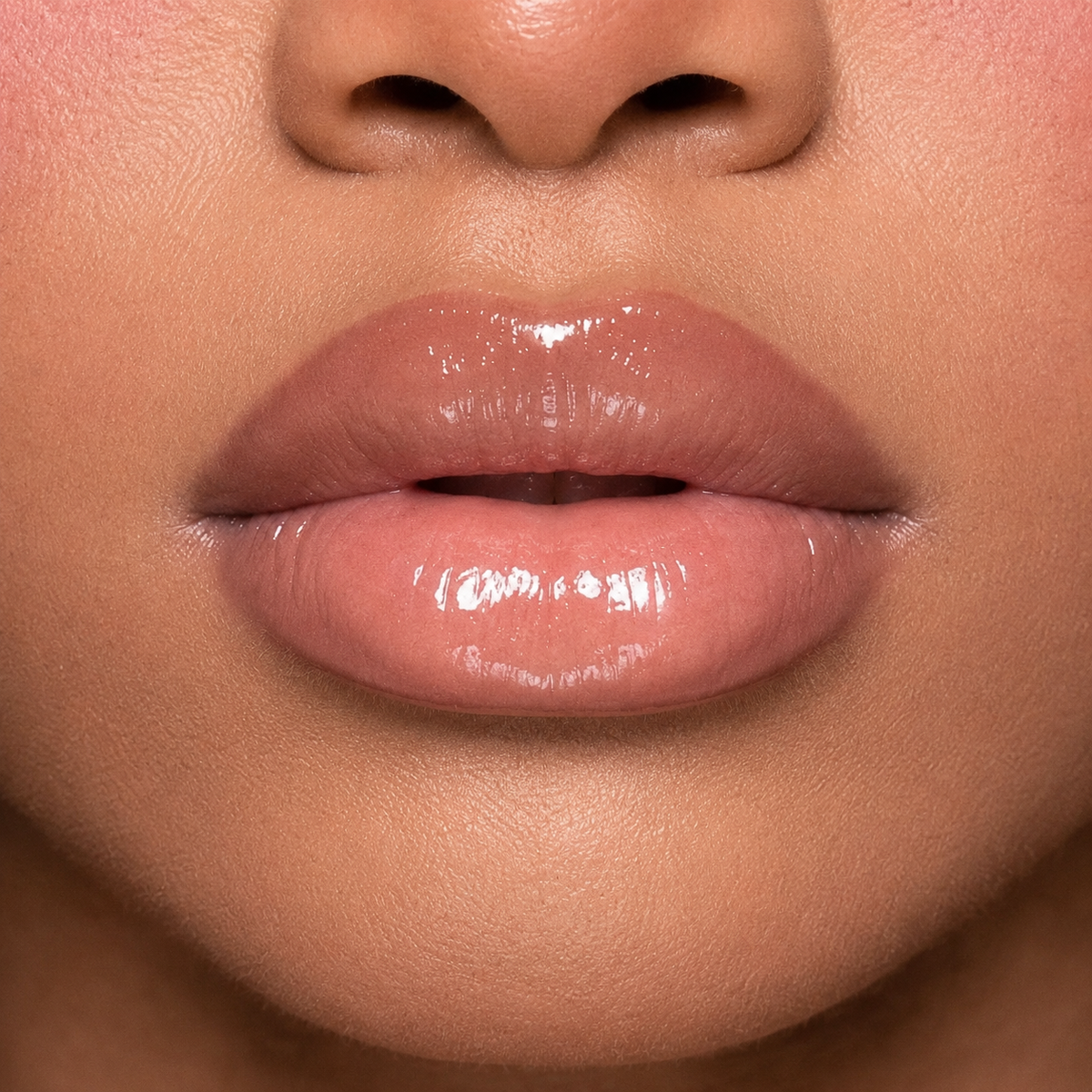 Close-up of a person's lips with a glossy lip color